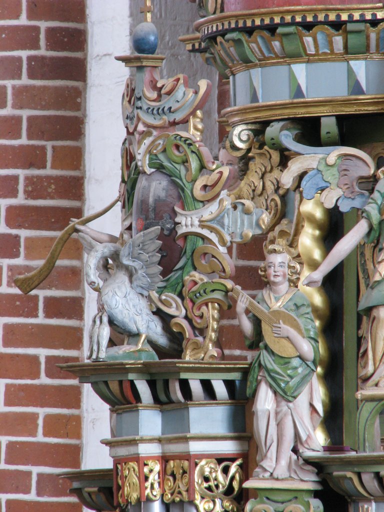 Bekroning Rugpositief vanuit het westen, Pelikaan, luitspeler westzijde