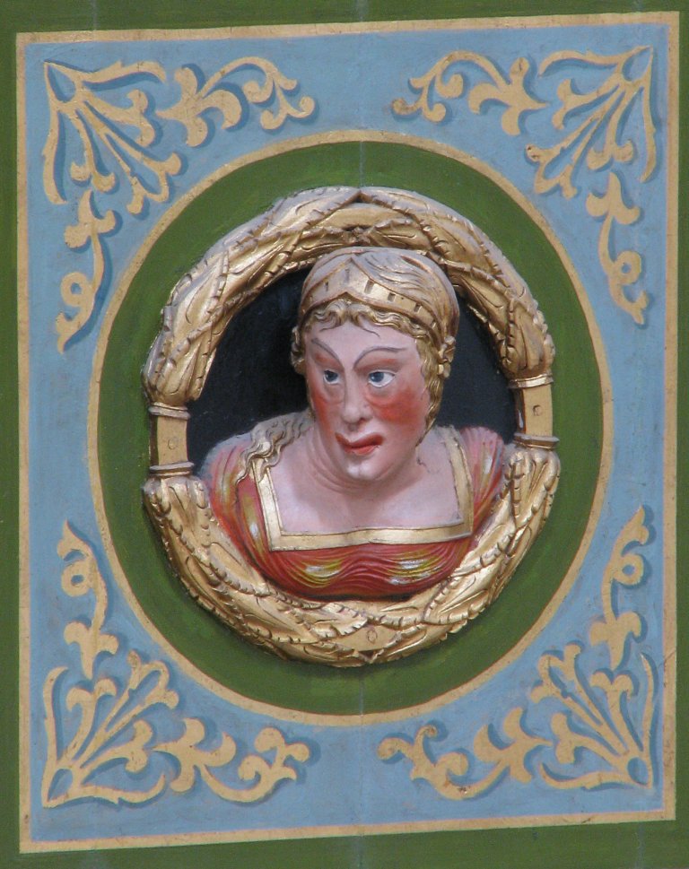 Vrouwenkop op Balustrade, links van het Rugpositief