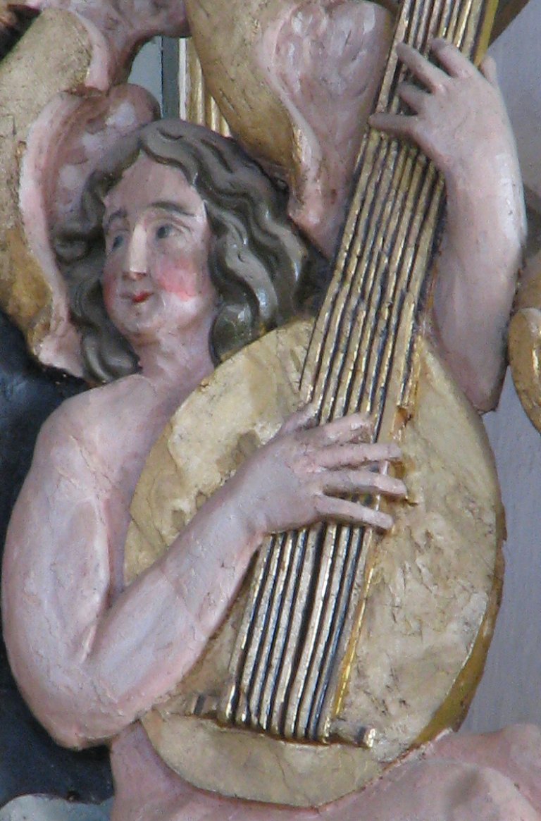 Hoofdkast, zittende luitspeler westelijk vleugelstuk detail